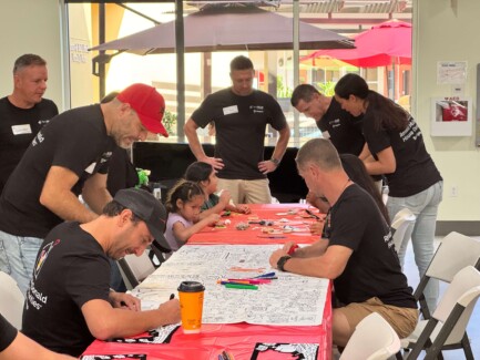 Volunteer day at the Ronald McDonald House in San Diego during WebexOne 2025 - group coloring with kids
