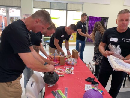 Volunteer day at the Ronald McDonald House in San Diego during WebexOne 2025 - group setting up supplies